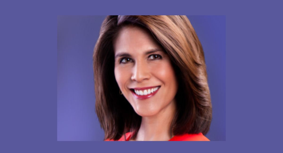 Andrea Fujii reporting live as a television journalist and news correspondent during a broadcast