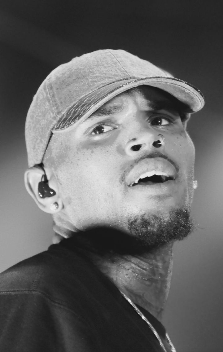 Chris Brown performing on stage in 2015